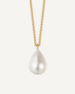 Pearl necklace with gold chain on a white background