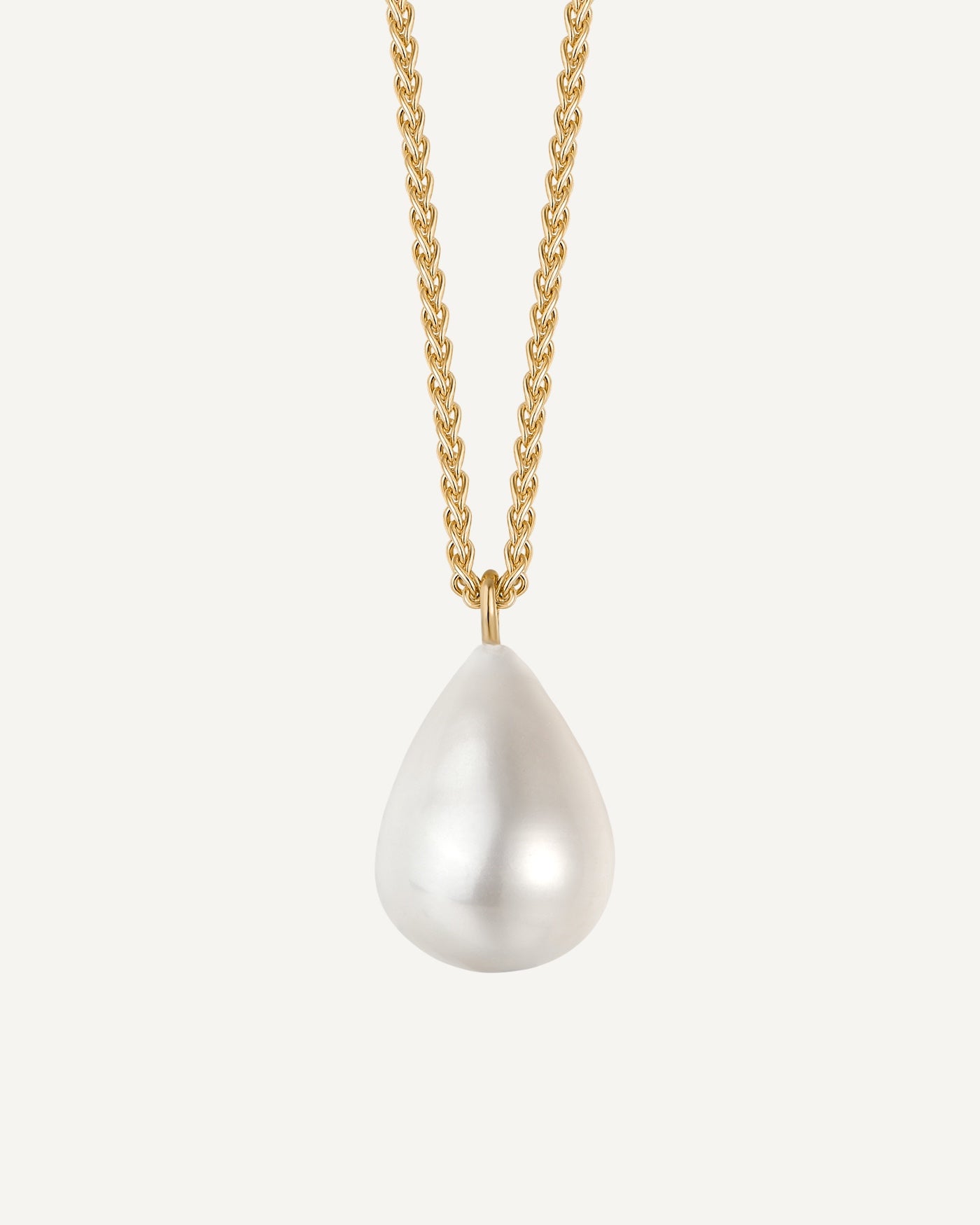 Pearl necklace with gold chain on a white background
