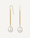 Gold earrings with pearl drops on a white background