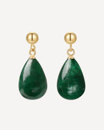 Green teardrop earrings with gold hooks on a white background