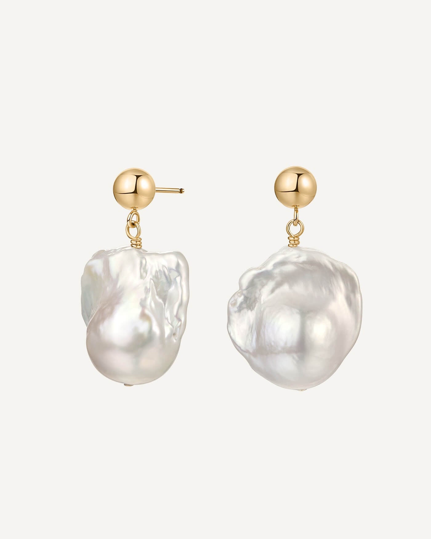 Pearl earrings with gold posts on a white background