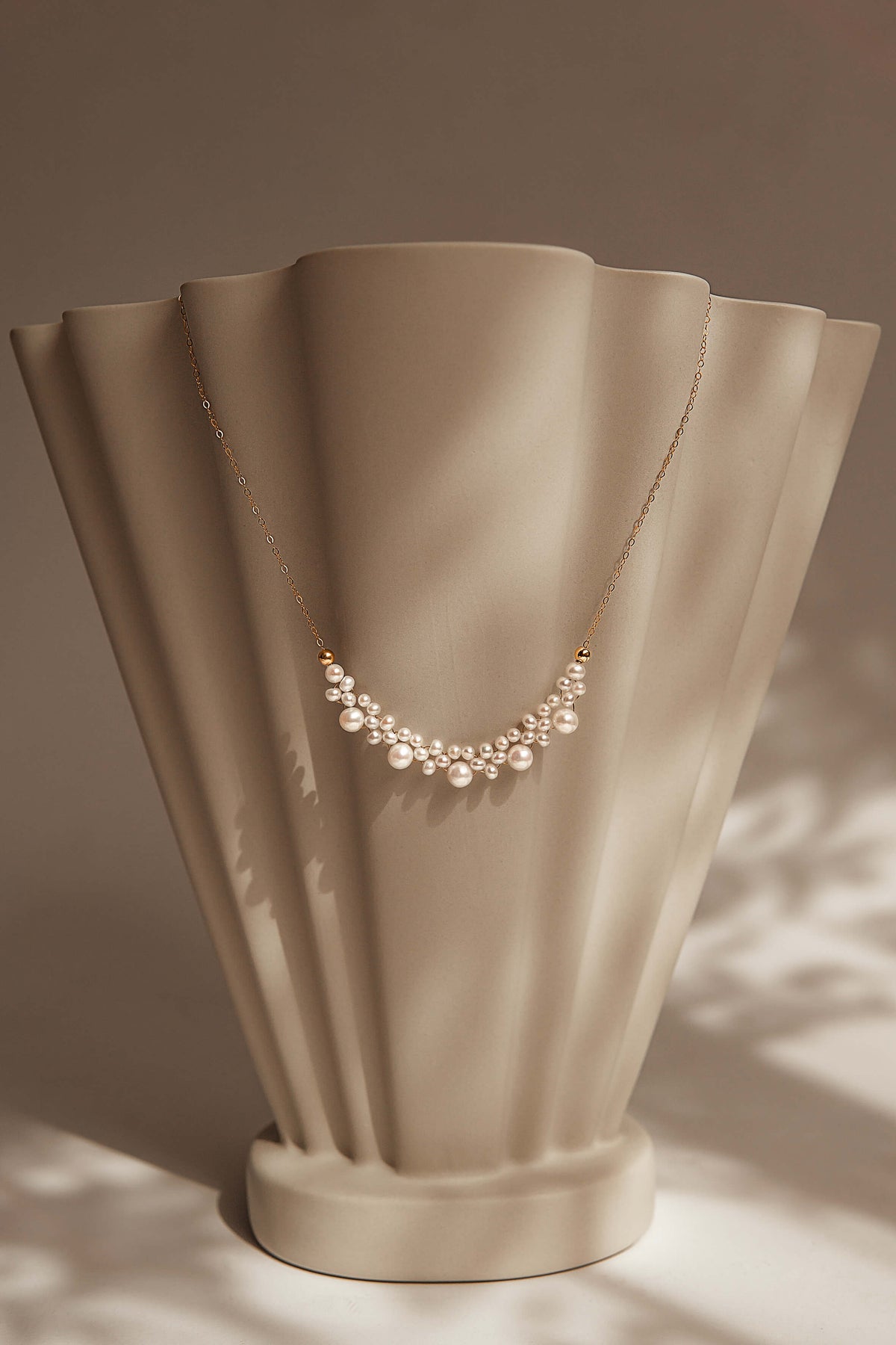 Pearl necklace on a beige mannequin bust