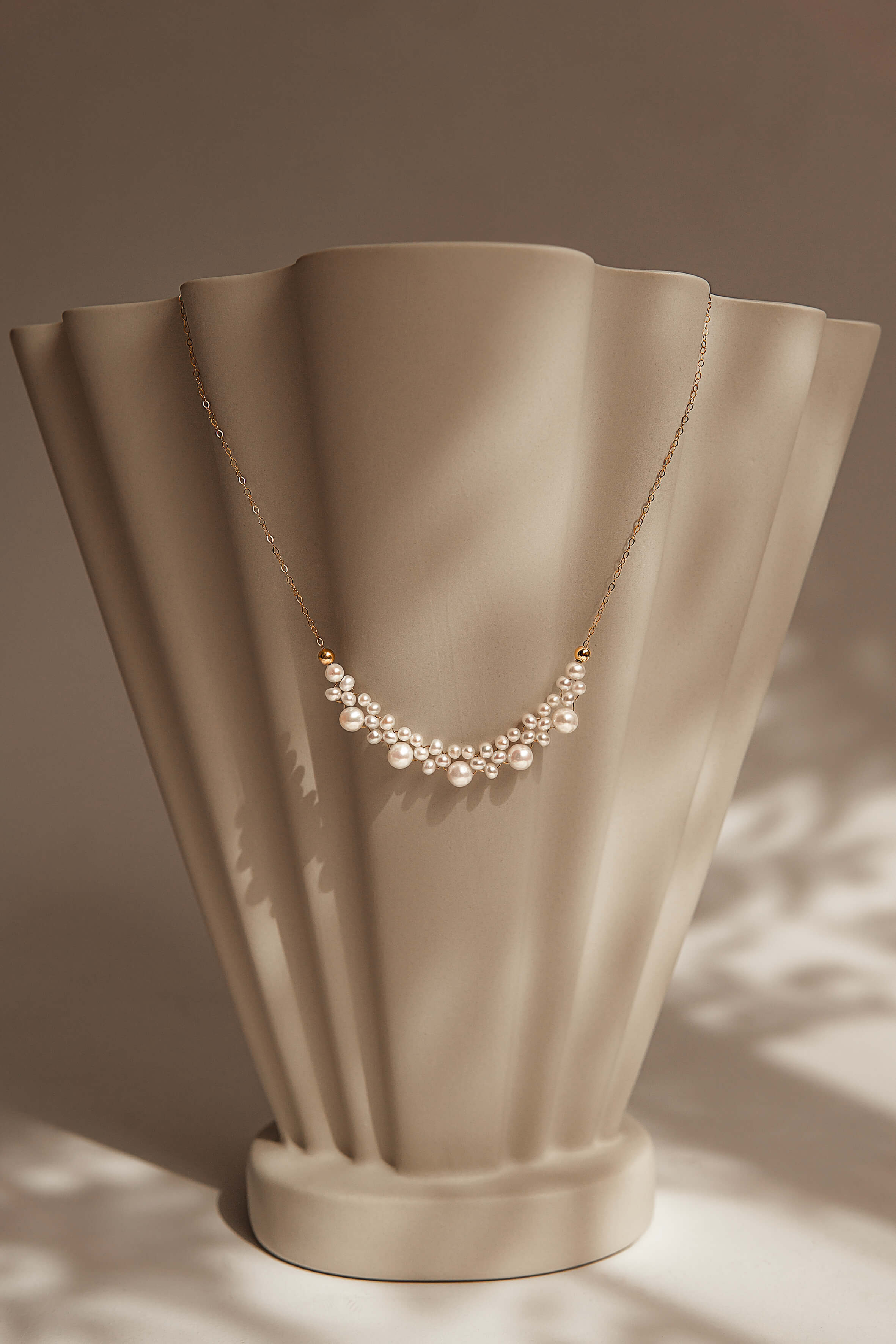 Pearl necklace on a beige mannequin bust