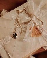 Necklace with heart pendant on a textured surface